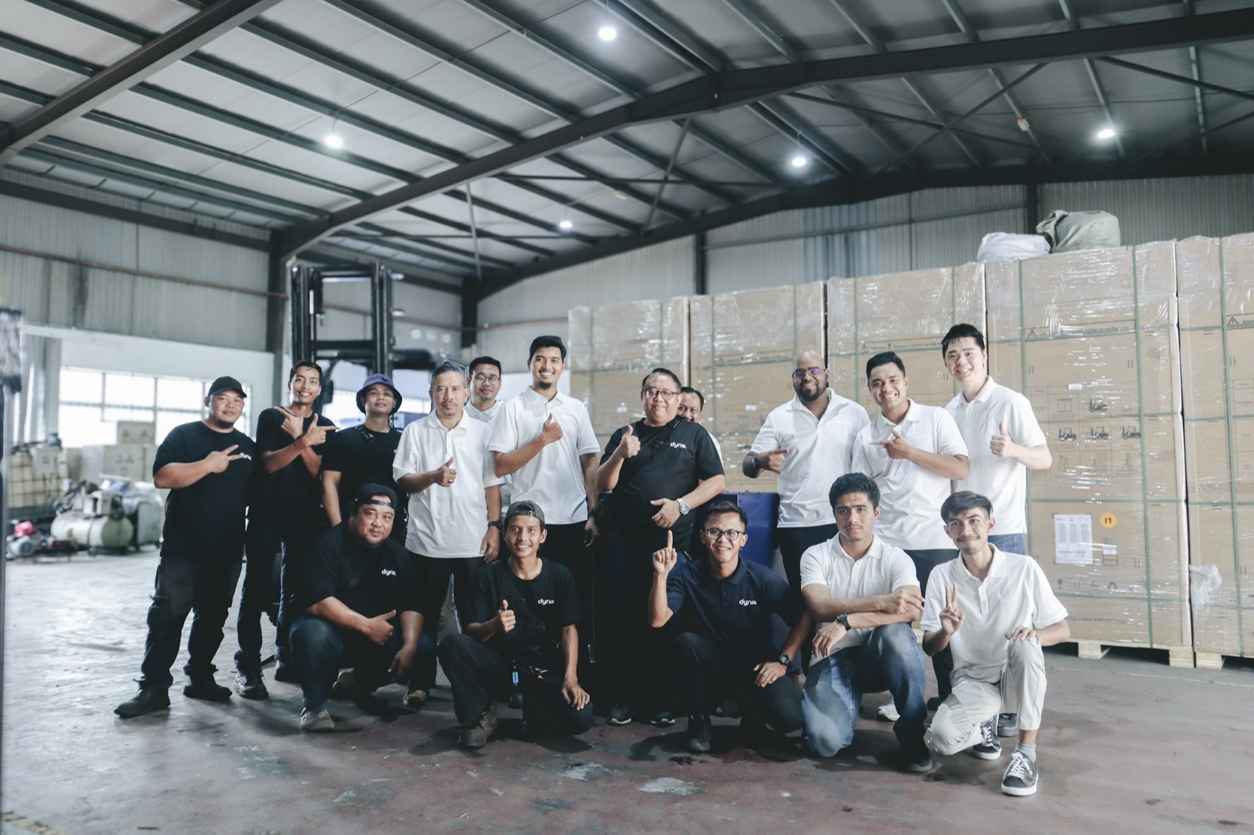 The Dyna team together in the warehouse